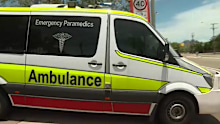 An ambulance leaves the school.
