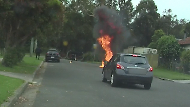 Police have released dashcam footage of two men allegedly starting a car fire and running away, following a suspected failed gang hit in Auburn yesterday. 