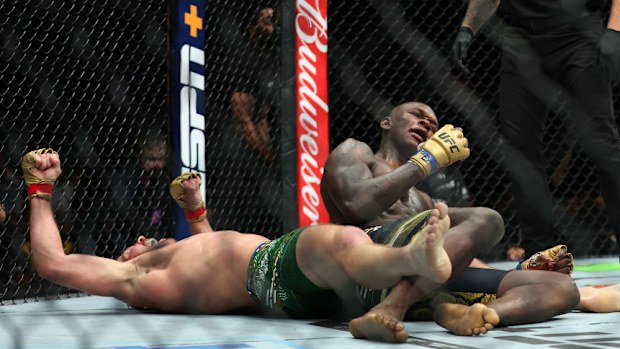 Dricus Du Plessis of South Africa celebrates winning his fight against Israel Adesanya of Nigeria by submission.