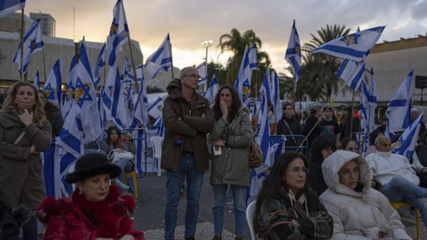 People gather at a vigil in Tel Aviv, Israel, hours after Hamas militants turned over four bodies to Israel, three of which have been identified by Israel as hostages Ariel and Kfir Bibas, and Oded Lifshitz, while the fourth, they said, is that of an unknown person. (AP Photo/Ohad Zwigenberg)