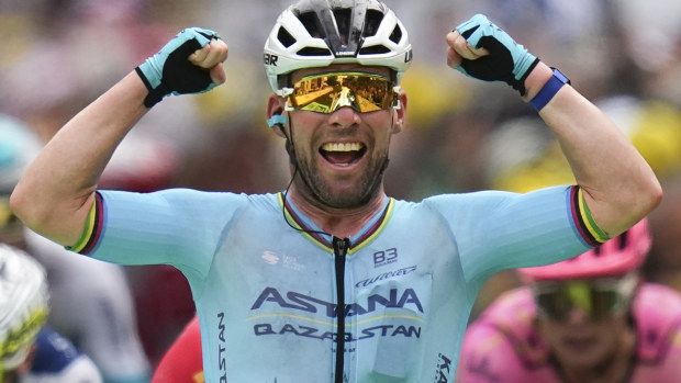 Britain's sprinter Mark Cavendish celebrates as he crosses the finish line to win a record 35th Tour de France stage.