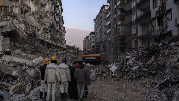 Rescue workers continue the search for victims of the earthquake in Antakya, Turkey, Saturday, Feb. 11, 2023. Rescue crews on Saturday pulled more survivors, including entire families, from toppled buildings despite diminishing hopes as the death toll of the enormous quake that struck a border region of Turkey and Syria five days continued to rise. (AP Photo/Petros Giannakouris)