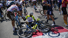 Eritrea's Biniam Girmay gets a helping hand from Belgium's Olivier Naesen after crashing during the 15th stage of the Tour de France.