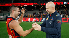 Adelaide's Josh Rachele and Matthew Nicks celebrate their win over Essendon in round 19.