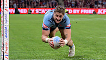 Zac Lomax darts over to score for the Blues. 