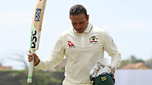 Usman Khawaja acknowledges the crowd as he walks off.