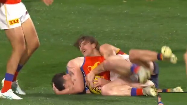 Lachie Neale clearly grabs for his head afterwards.