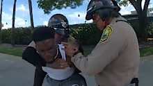 Tyreek Hill under arrest.