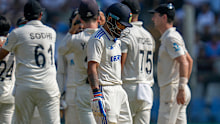 Virat Kohli walks off after being dismissed.