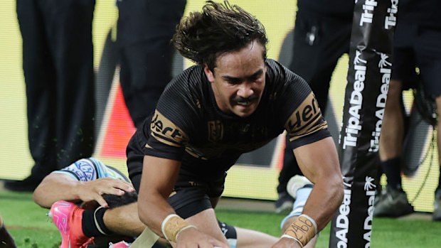 Daine Laurie of the Panthers scores a try.