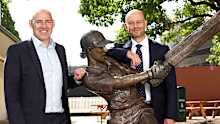 Cricket Australia CEO Nick Hockley and Australian Cricketers' Association CEO Todd Greenberg pose next to the Belinda Clarke sculpture.