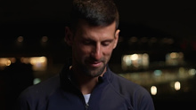 Novak Djokovic gets up to walk out of an interview. 