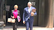 Azzra Hughes outside court with her lawyer.