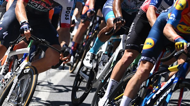 The peloton leans into a corner as part of a descent during stage one of the Tour Down Under.