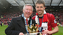 Manager Sir Alex Ferguson and Michael Carrick of Manchester United celebrate with the Premier League trophy.