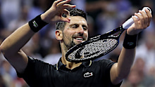 Djokovic plays the violin after a win in the US.