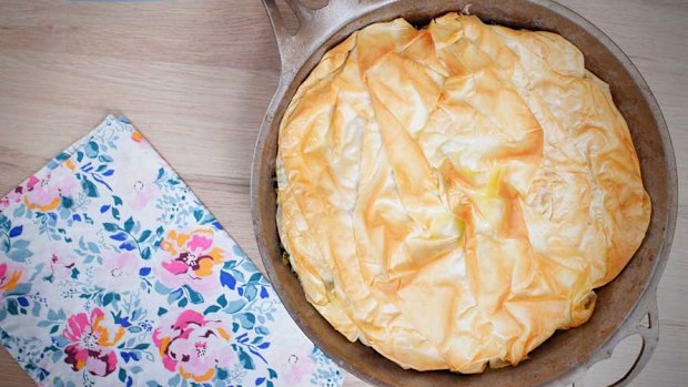 This is what perfect, crispy filo pastry on top of a spinach pie in a pan looks like