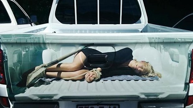 Image of a bound woman on a Townsville ute has been branded violent and offensive (Jane Chester via Townsville Bulletin)