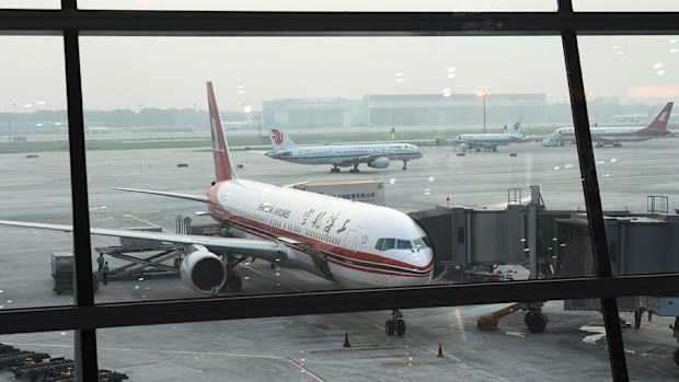 Aircrafts wait to depart at Beijing International Capital Airport (MARK RALSTON/AFP/Getty Images)