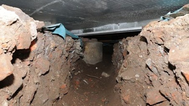 A tunnel dug under a Tesco supermarket in Eccles, Manchest (Greater Manchester Police/Facebook)