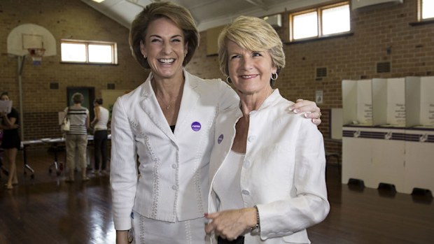 Liberal politicians Julie Bishop and Michaelia Cash arrive to cast their votes on Saturday, April 5, 2014 (AAP Image/Tony McDonough)