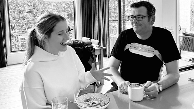 Daniel Andrews sitting in a back brace at home.