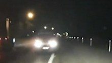 The car is seen in dashcam on the wrong side of the road.