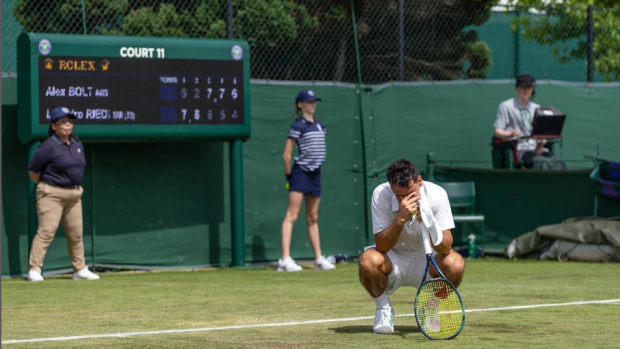 Alex Bolt reacts after securing spot in men's singles draw at Wimbledon qualifiers. 