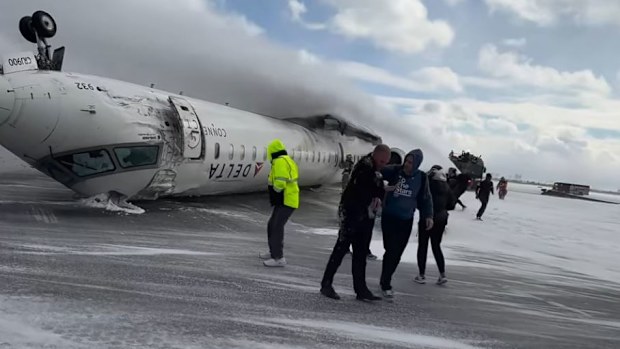 Passengers who survived a dramatic plane crash in Canada have recalled hanging upside down in the aircraft after it flipped on the runway.