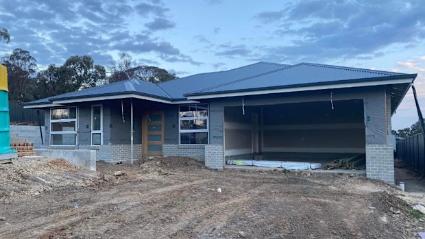 Mr Girle-Bennett and his wife say they were forced to terminate their first building contract after no work was done in six months. The delay cost them dearly.