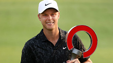 Cam Davis of Australia poses with the trophy after winning on the fifth sudden death playoff hole against Troy Merritt during the final round of the Rocket Mortgage Classic.