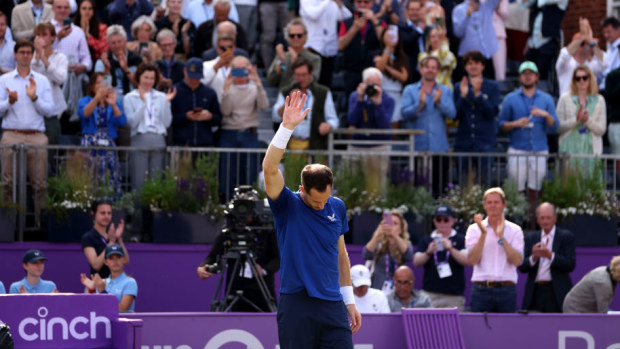Andy Murray acknowledges the fans as he is forced to pull out of the match due to injury against Jordan Thompson.
