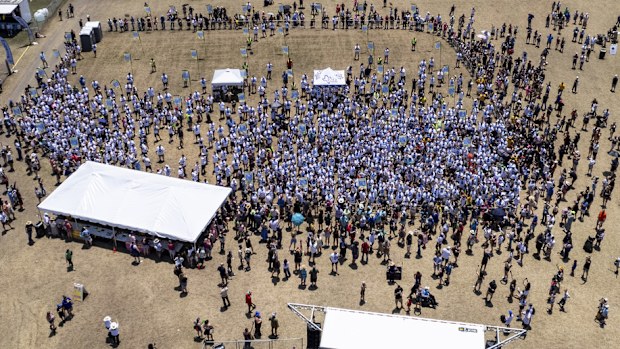 This photo taken by a drone and provided by the City of Kyle, Texas, shows an attempt by the city to break the world record for the largest gathering of people with one name, Saturday, May 18, 2024, in Kyle. (City of Kyle, Texas via AP)