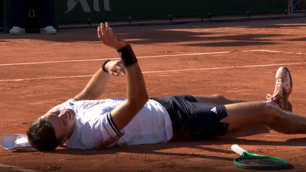 Jakub Mensik is in agony after his five-set win at Roland-Garros.