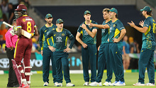 ADELAIDE, AUSTRALIA - FEBRUARY 11: Mitchell Marsh of Australia stands with his team as the umpire gets clarification on the run out of Alzarri Joseph of the West Indies by Spencer Johnson of Australia. Since no one in Australian team appealed it was ruled Not Out during game two of the mens T20 International series between Australia and West Indies at Adelaide Oval on February 11, 2024 in Adelaide, Australia. (Photo by Sarah Reed/Getty Images)