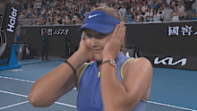 Mirra Andreeva reacts after being reminded of a statistic about Australian Open winners.