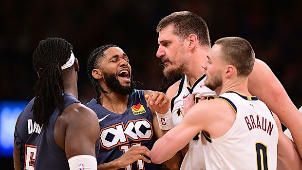 Isaiah Joe gets in between Luguentz Dort and Nikola Jokic during the second half.