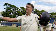 Glamorgan's Ryan Hadley celebrates after reaching 50 runs.