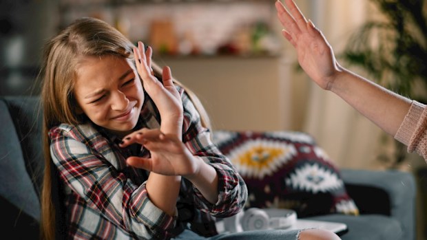 Mother hitting her child. 