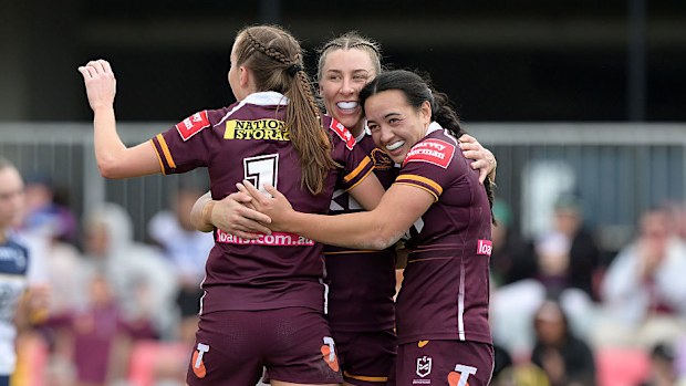 Tamika Upton of the Broncos celebrates with teammates.