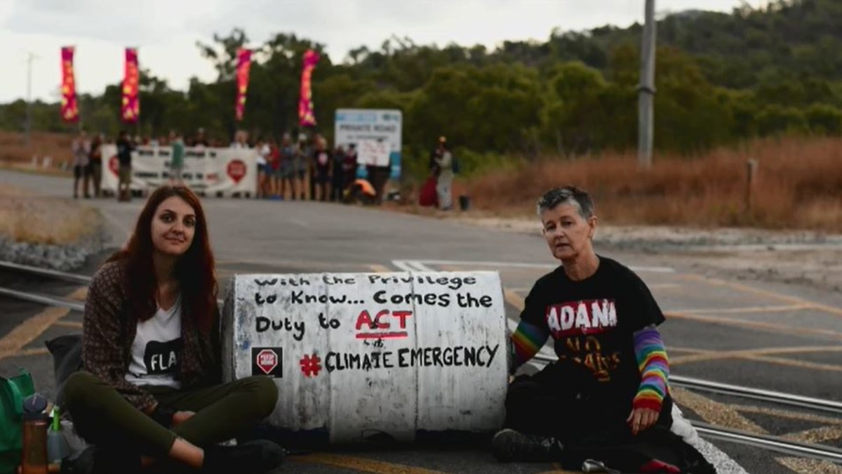 Queensland news: Adani protesters charged after 'chaining themselves to ...