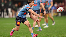 Connor Watson passes the ball during game two of the Men's State of Origin series.