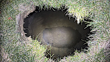 Pennsylvania State Police shows the top of a sinkhole in the village of Marguerite.