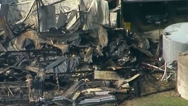 Woman charged with murder after man, girl die in Queensland shed fire ...