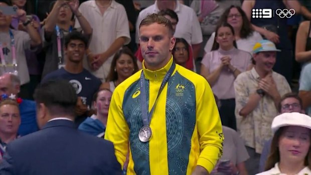 Kyle Chalmers accepts his silver medal.