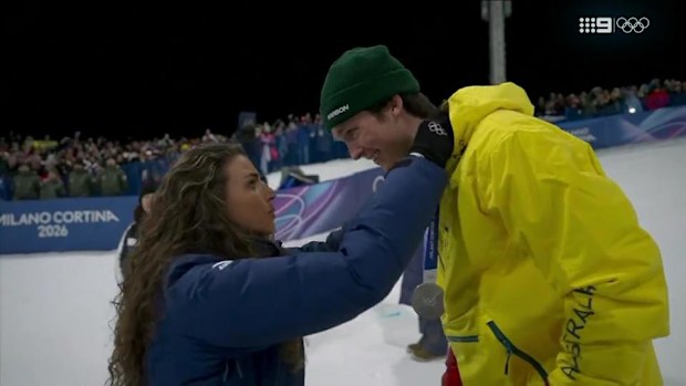 Scotty James is presented his silver medal by Jess Fox.