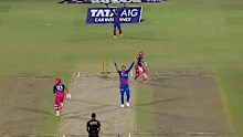Mitchell Starc takes a wicket.