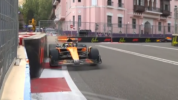 McLaren's Oscar Piastri clips the wall during practice.