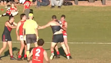 Brendan Fevola gets into it with his opponent. 