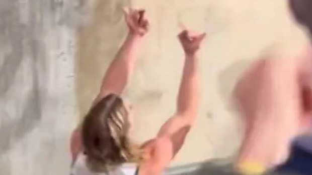 Bailey Smith flips a fan the double bird after the Cats' Gather Round win over the Adelaide Crows.